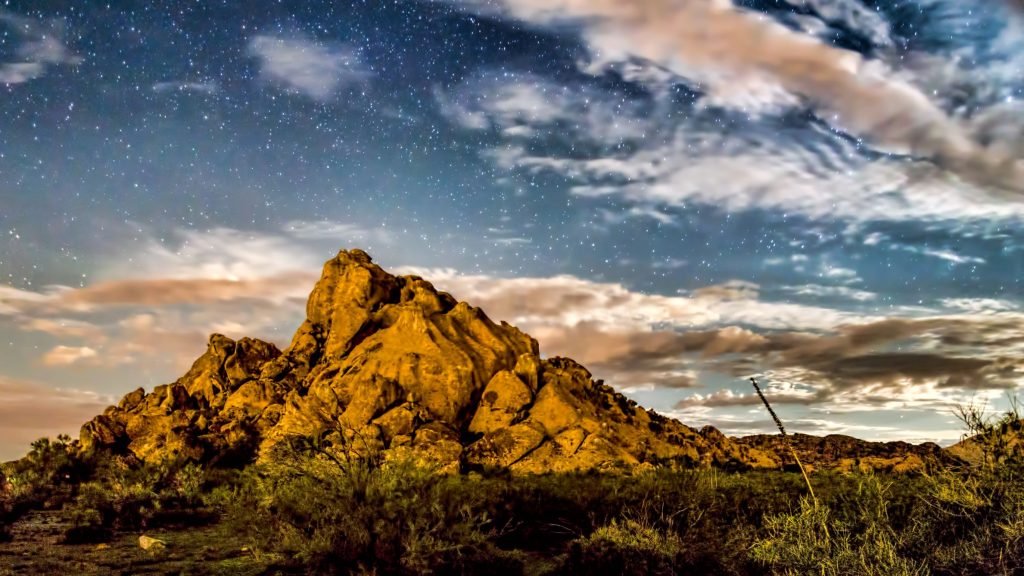 Hueco Tanks State Park, Texas, under a cloudy, starry sky